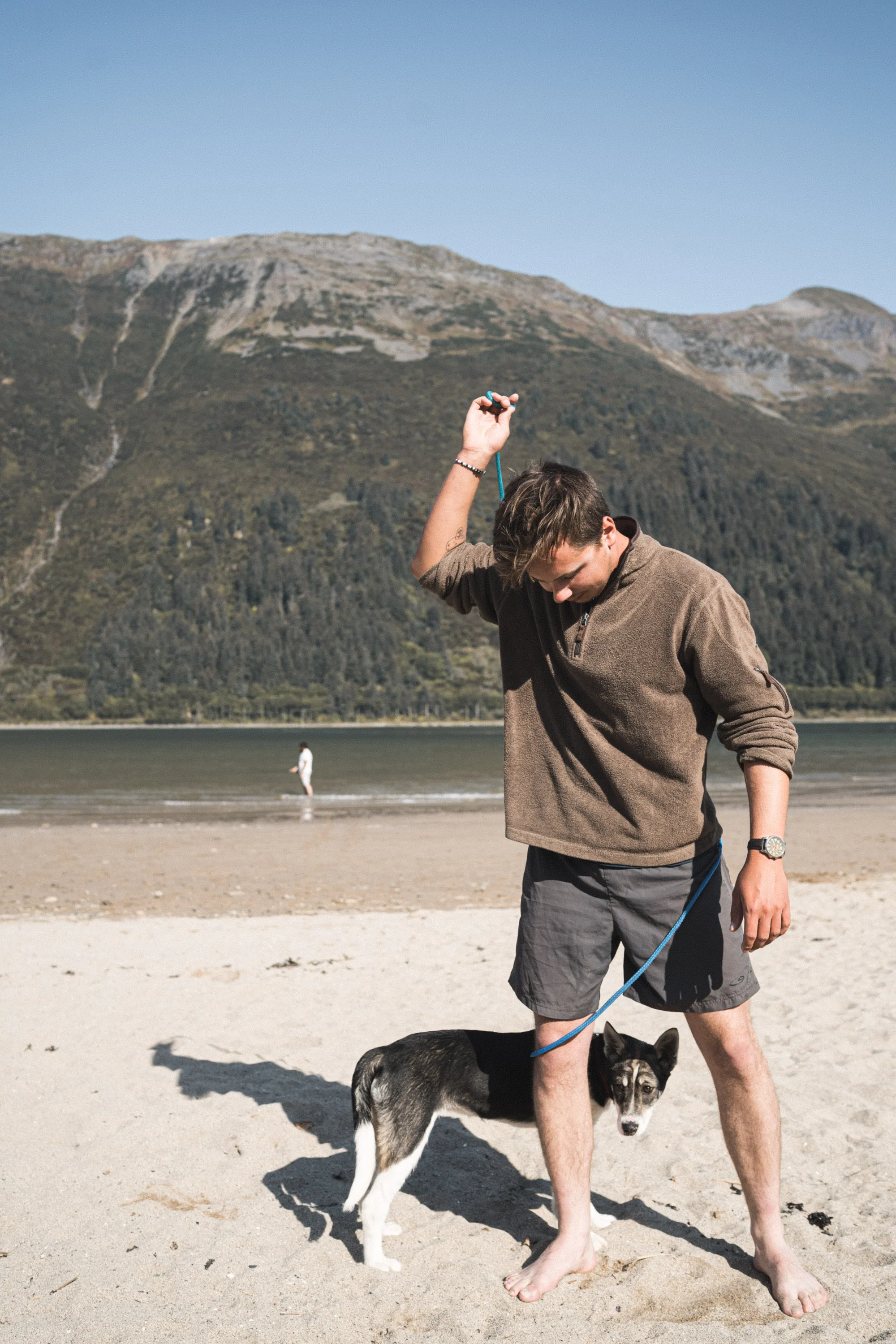 Sam Robinson with his dog beside a mountain lake in Vermont